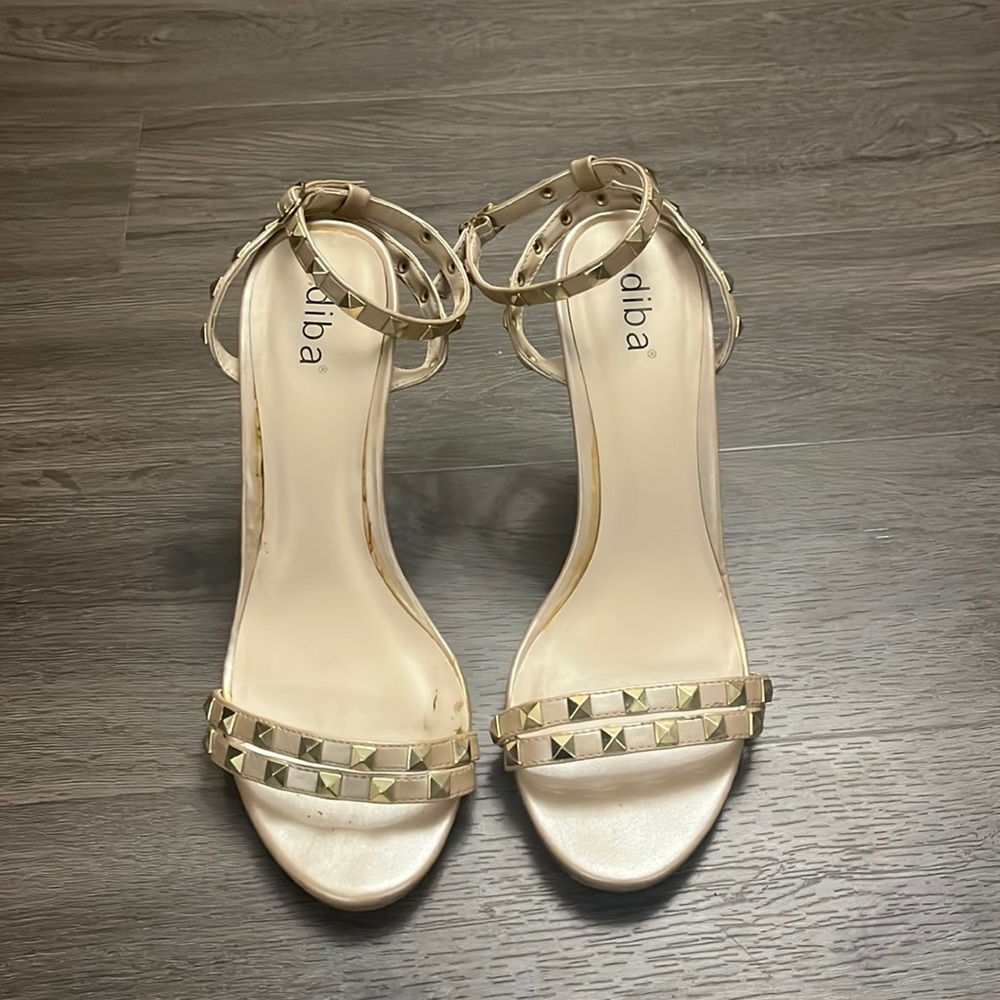 Women’s studded nude heels.